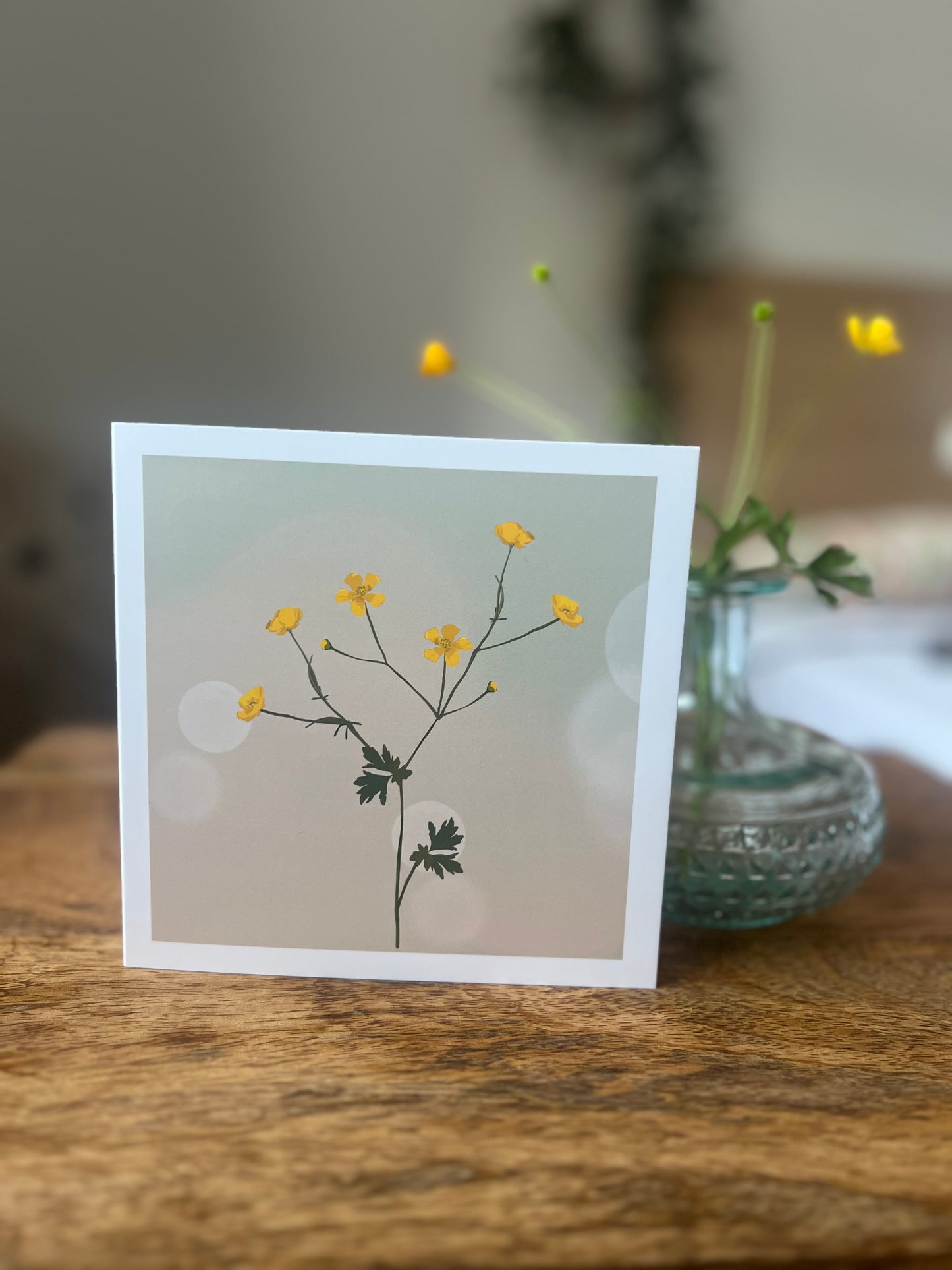 Yellow buttercup with Hazy Summer Background