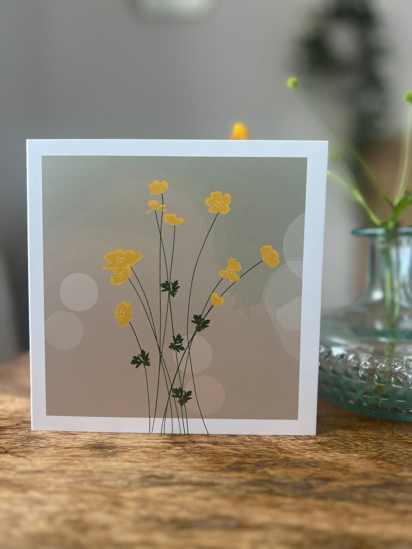 Yellow buttercup straight stem hazy background