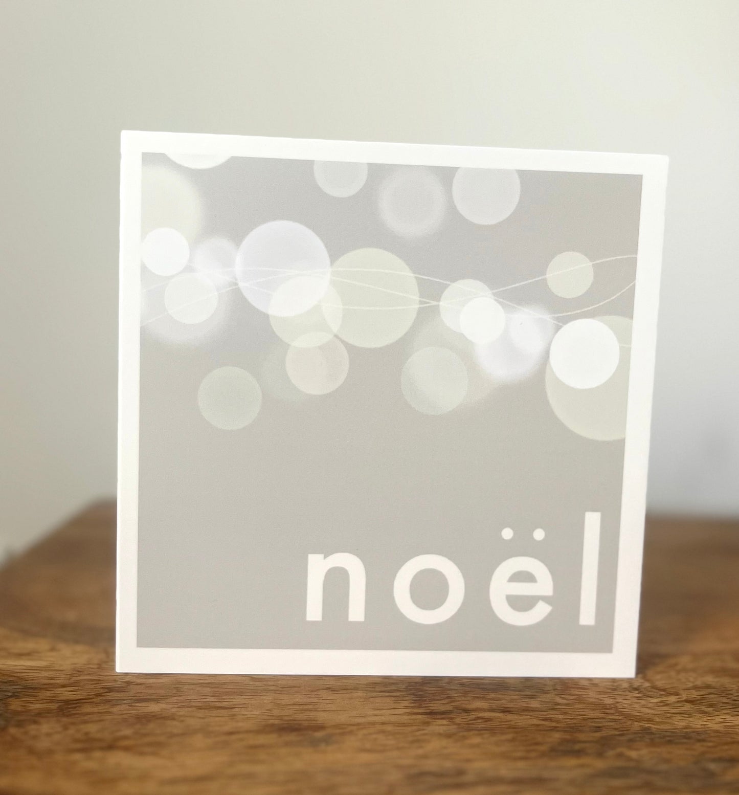 A Minimalist Neutral Noël and lights greeting card l