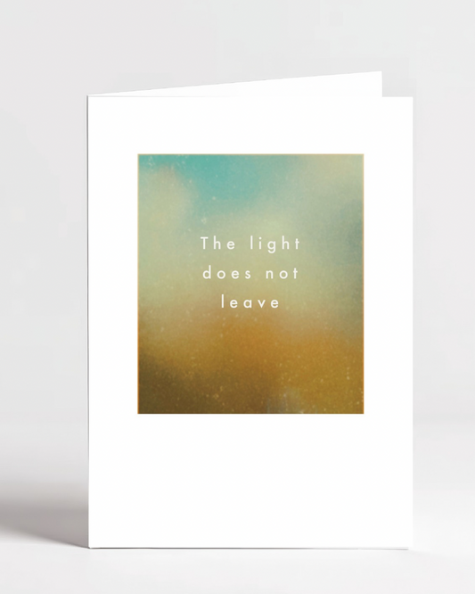 Greeting card with gradient design and text 'The light does not leave' on a white background